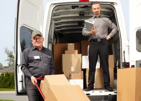 Packed boxes and wrapped household items ready for local removal service
