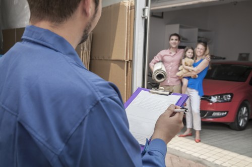 Moving team preparing safe lifting equipment for a man and van service
