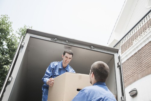 Packed moving boxes and furniture ready for transport in a local home move