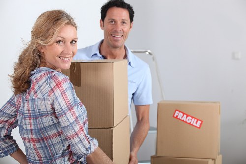 Furniture and boxes being handled for a student move in a Richmond area flat